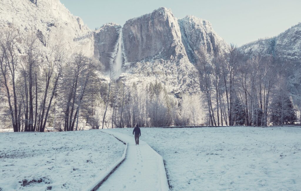Yosemite in the winter man walking on trail